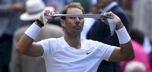 Nadal dazzled by Wimbledon sun in first round win