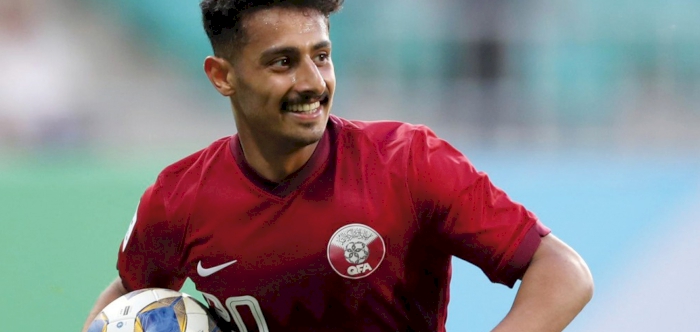 Qatar, Iran share points after late goals