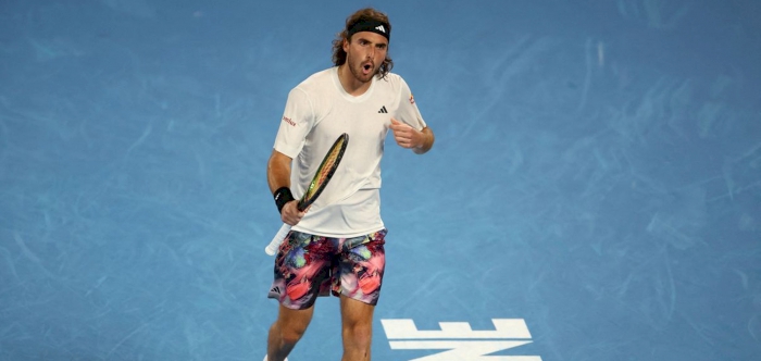 Top seed Swiatek crashes out of Australian Open, Tsitsipas survives